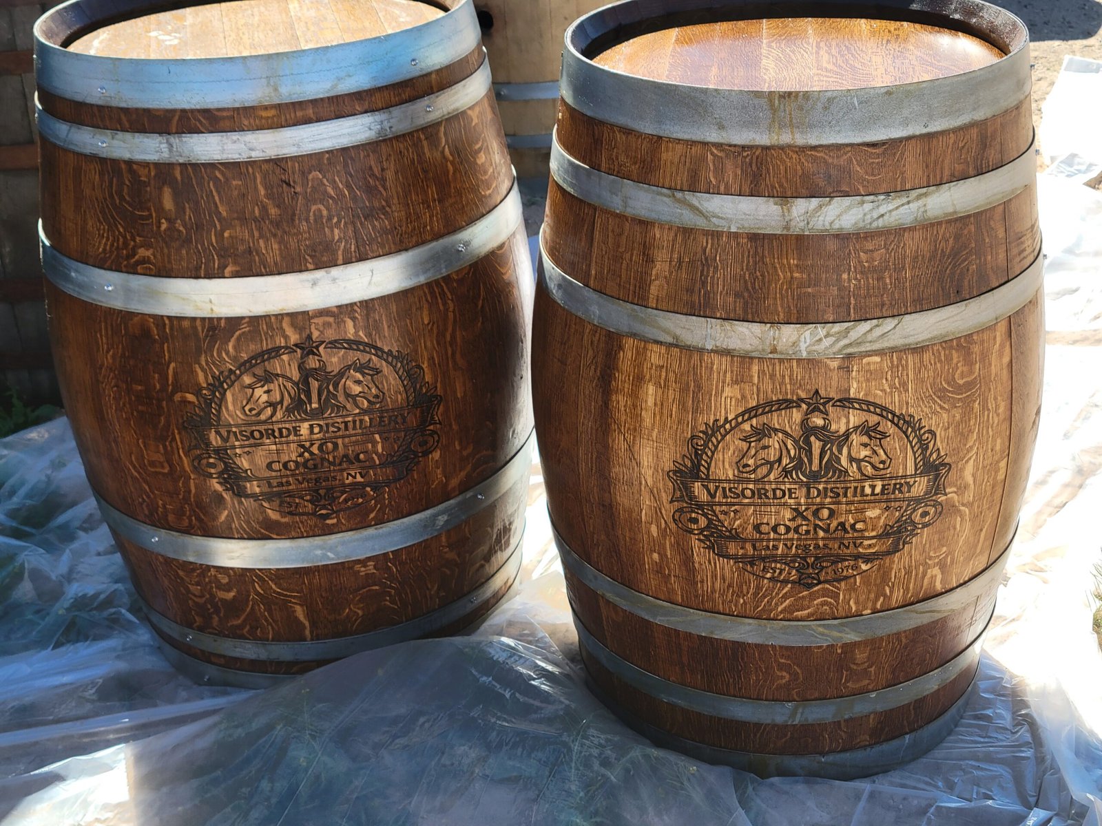 Pair of custom engraved distillery barrels by Crafted Casks