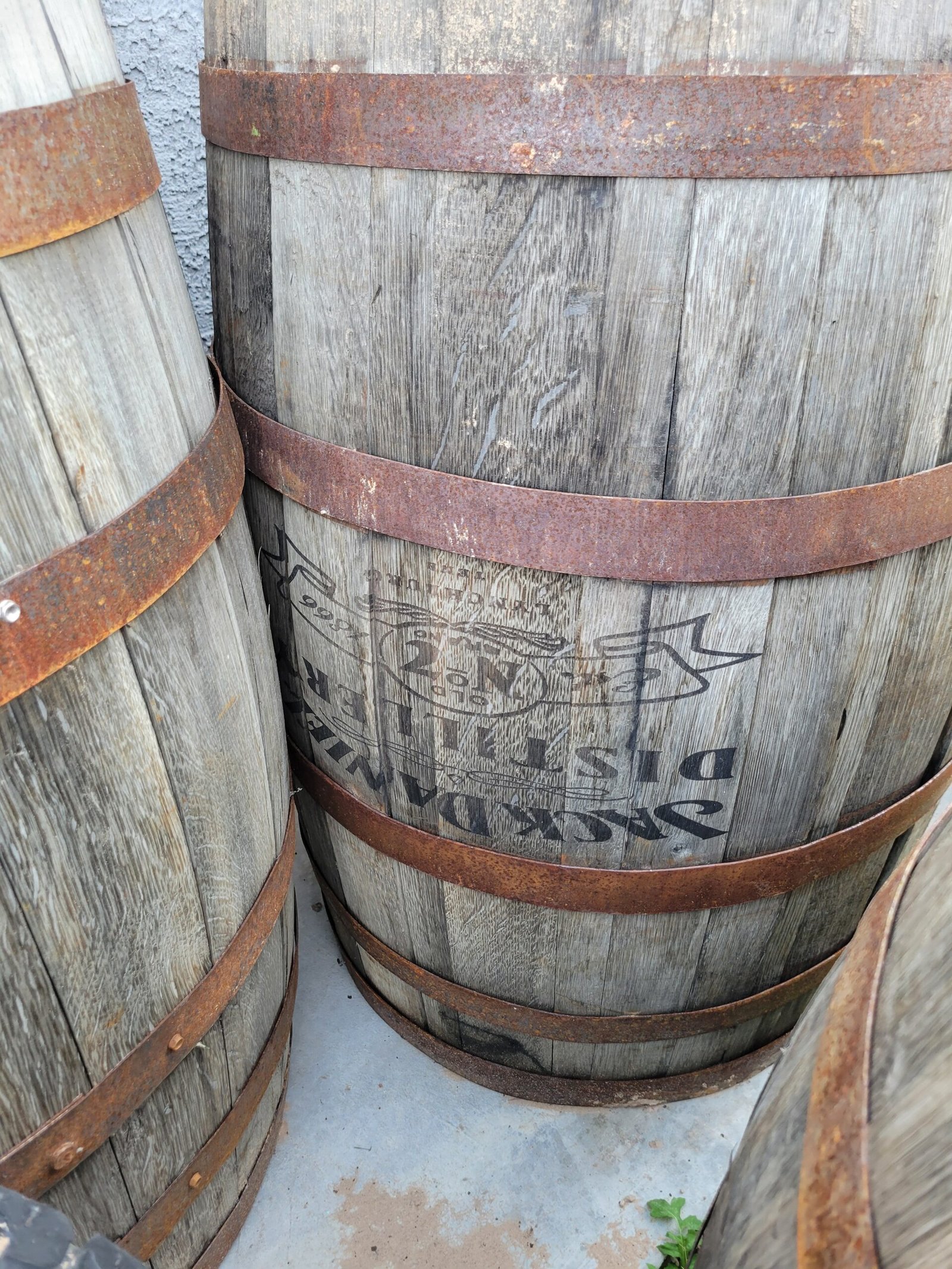 Yard of authentic weathered whiskey barrels